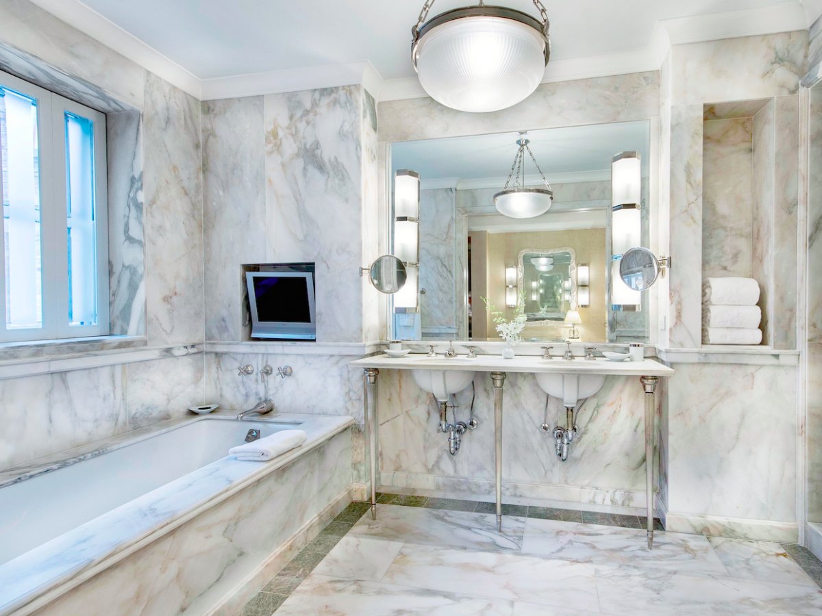 the master bath is covered in italian marble