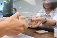 Tiền gửi tăng nhanh hơn tín dụng, thanh khoản ngân hàng bớt căng